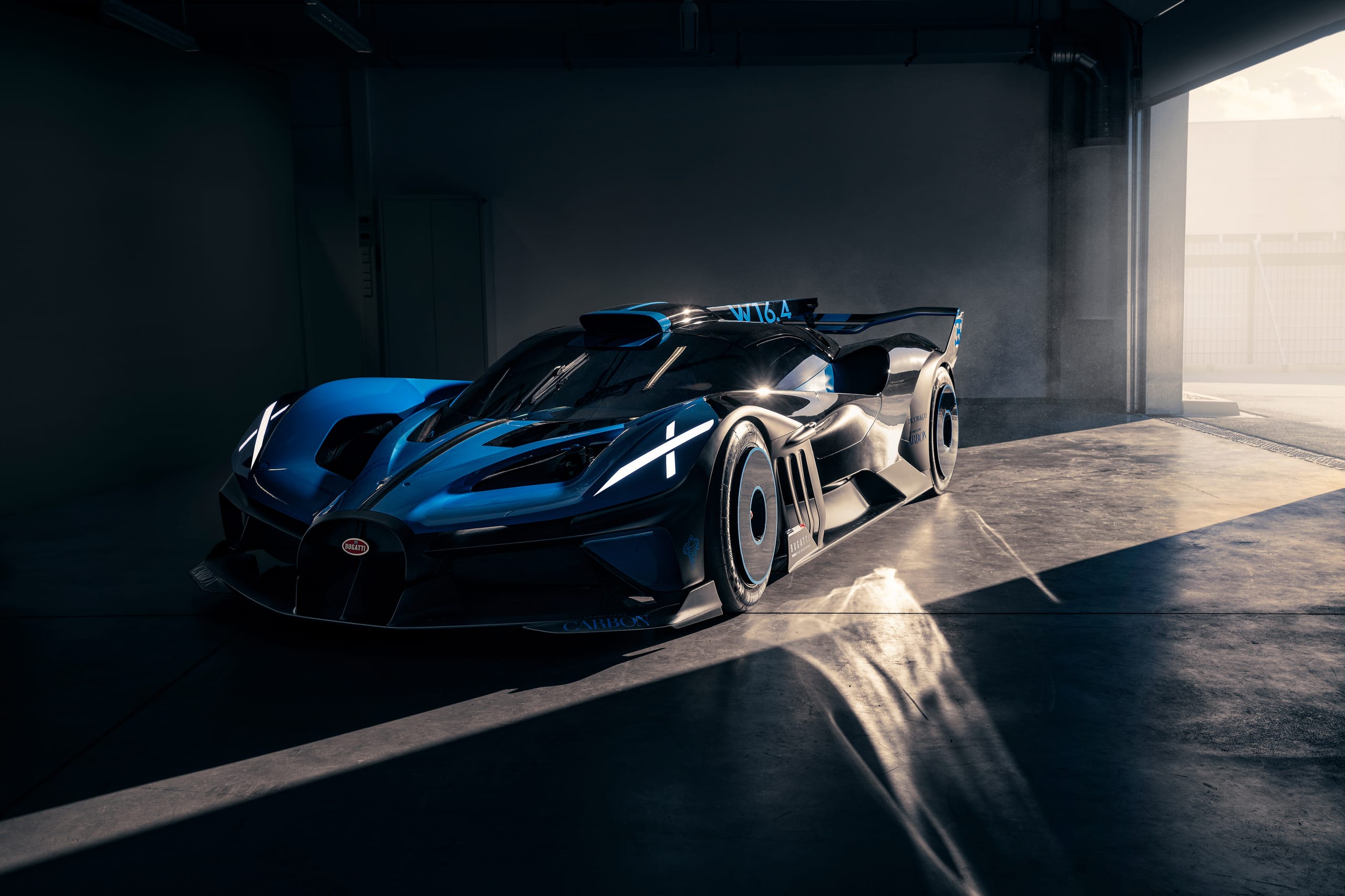 Bugatti Bolide front three-quarter view showing aerodynamic wheel covers and W16.4 engine bay