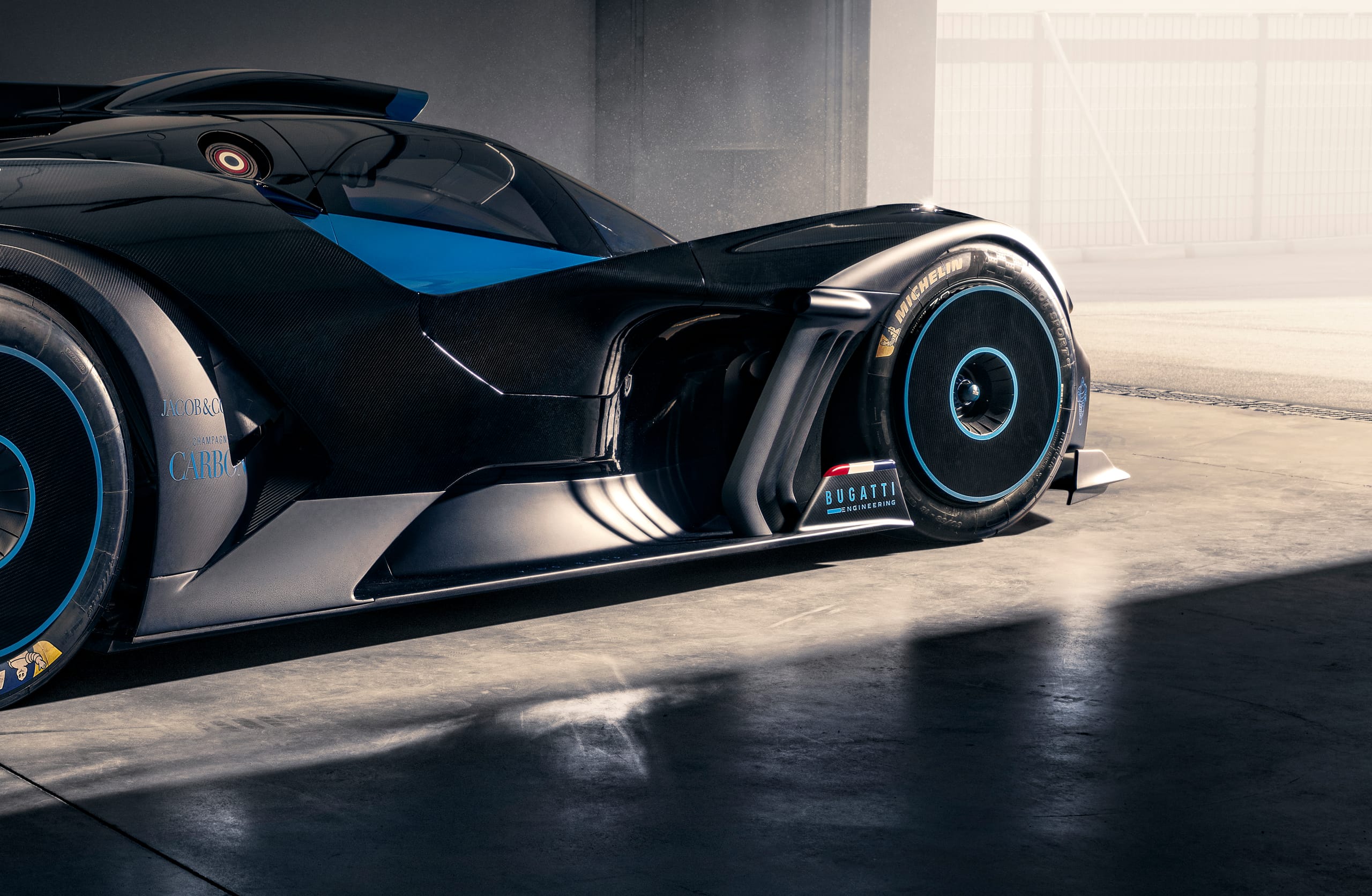 Close-up of Bugatti Bolide side pod and underfloor diffuser showing carbon fibre bodywork and aerodynamic detailing