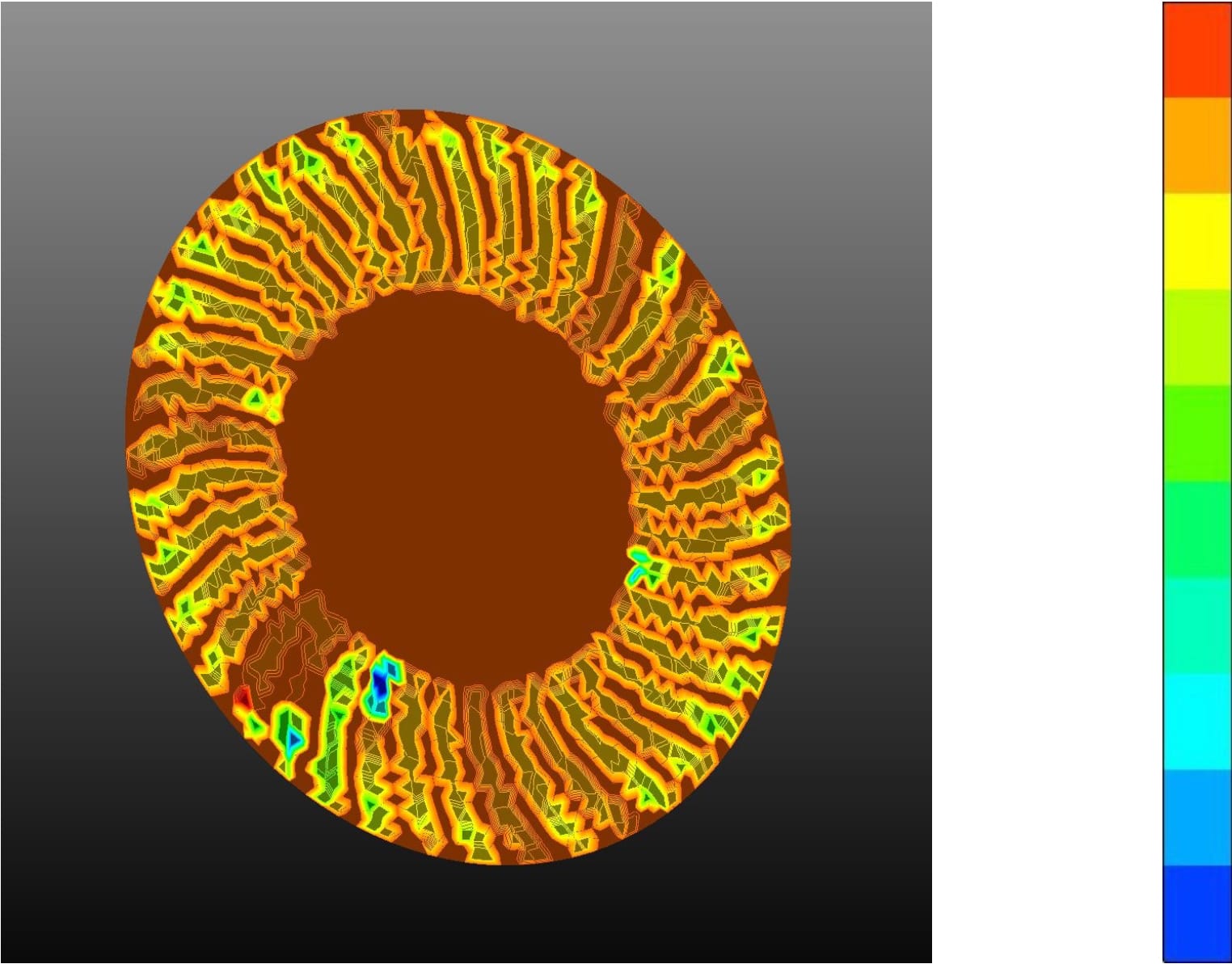 Figure 9: Temperature distribution on the backwards curved vane rotor section showing cooler regions in contact with airflow (left), with pressure legend (right)
