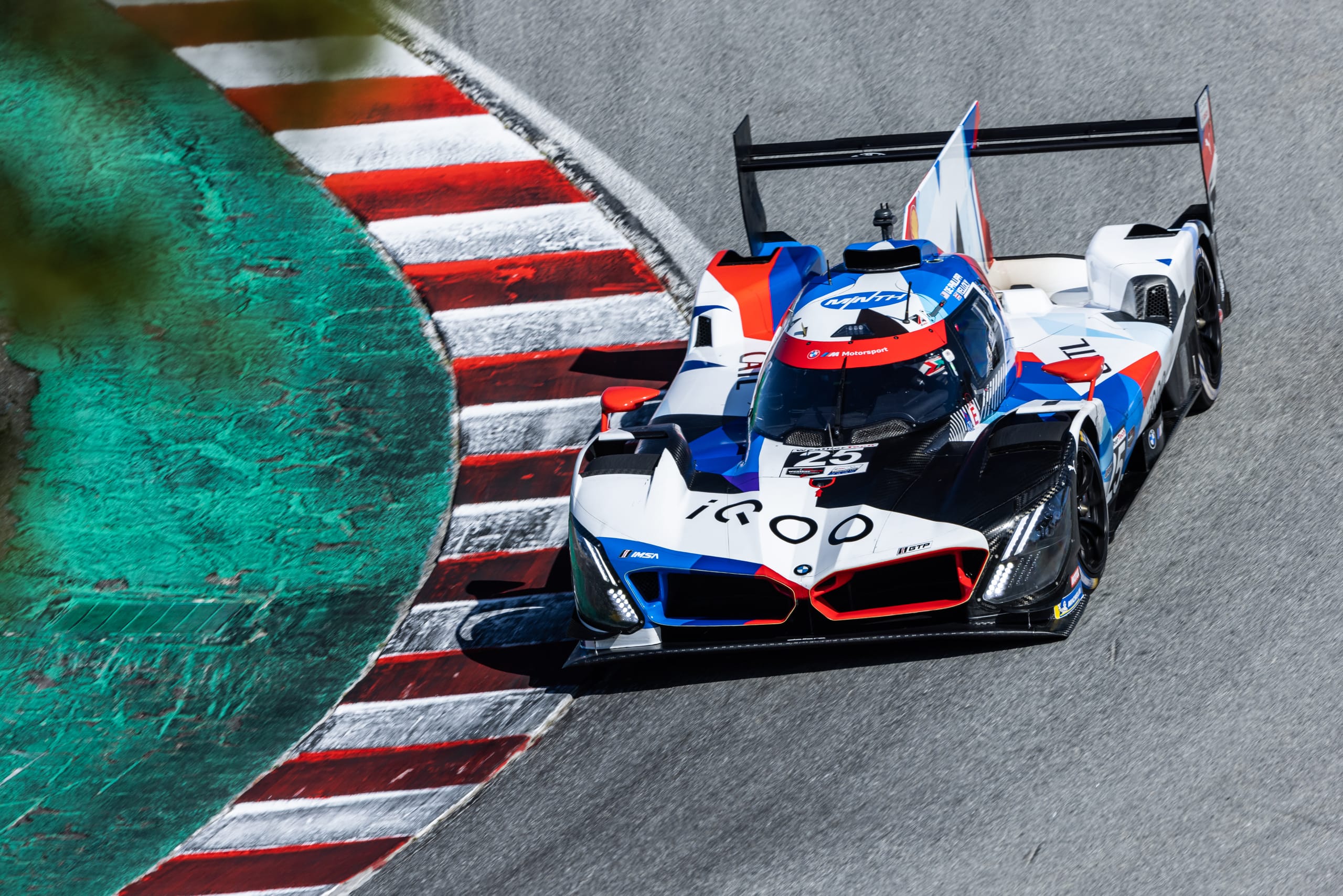 BMW M Hybrid race car cornering at Laguna Seca