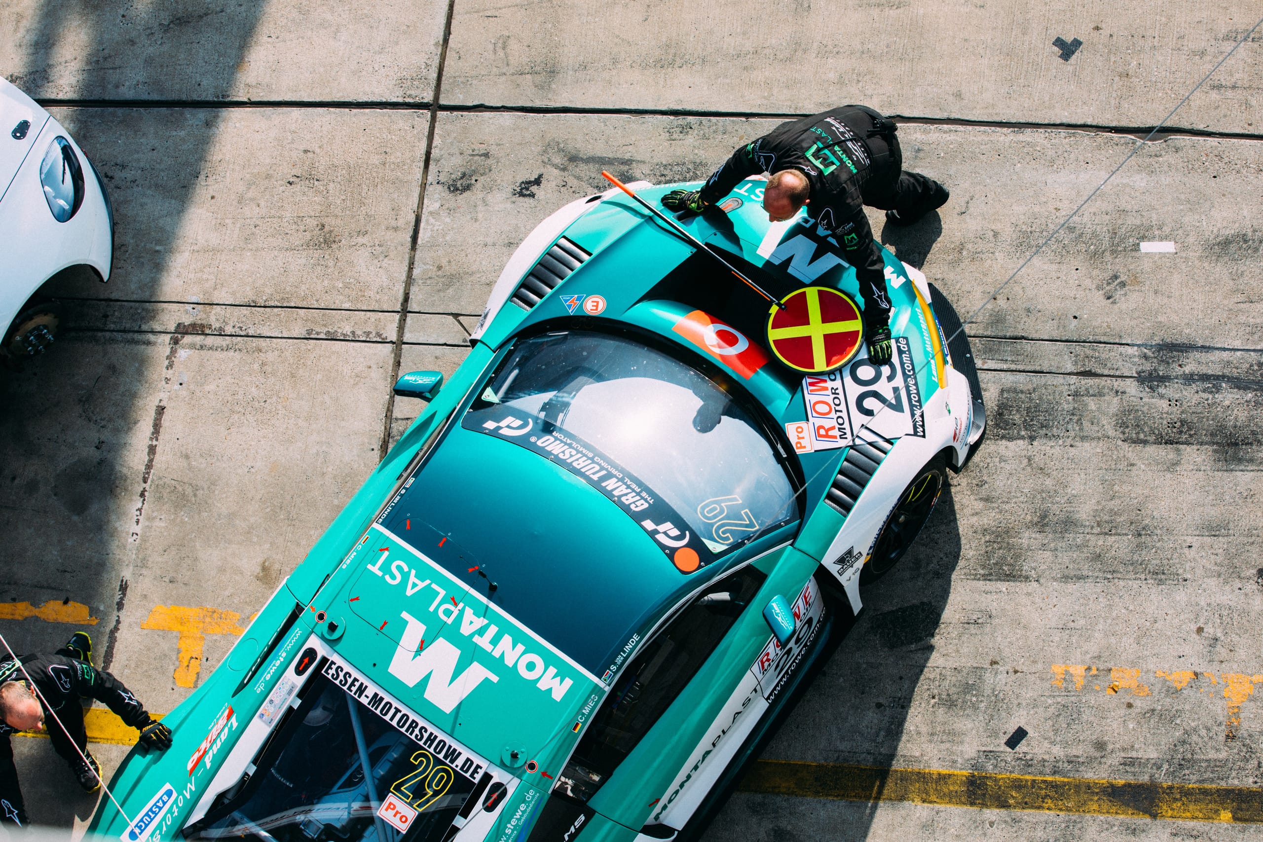 Race engineer working with simulation software to optimise racecar performance before and during an event