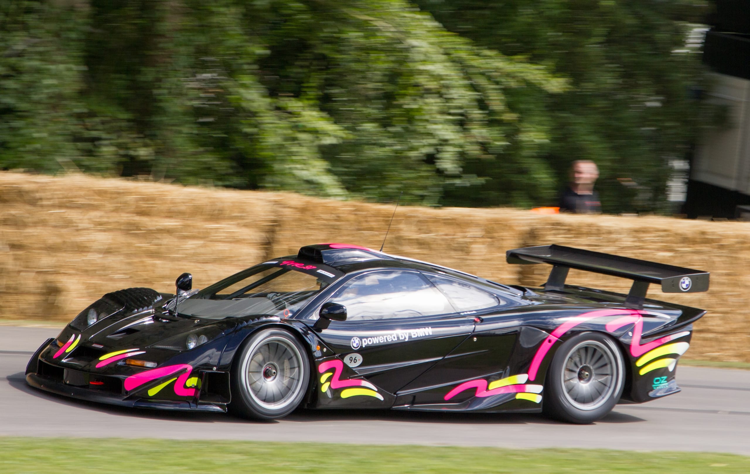 McLaren F1 GTR Longtail in black and pink livery at the Goodwood Festival of Speed, showing the extended rear overhang