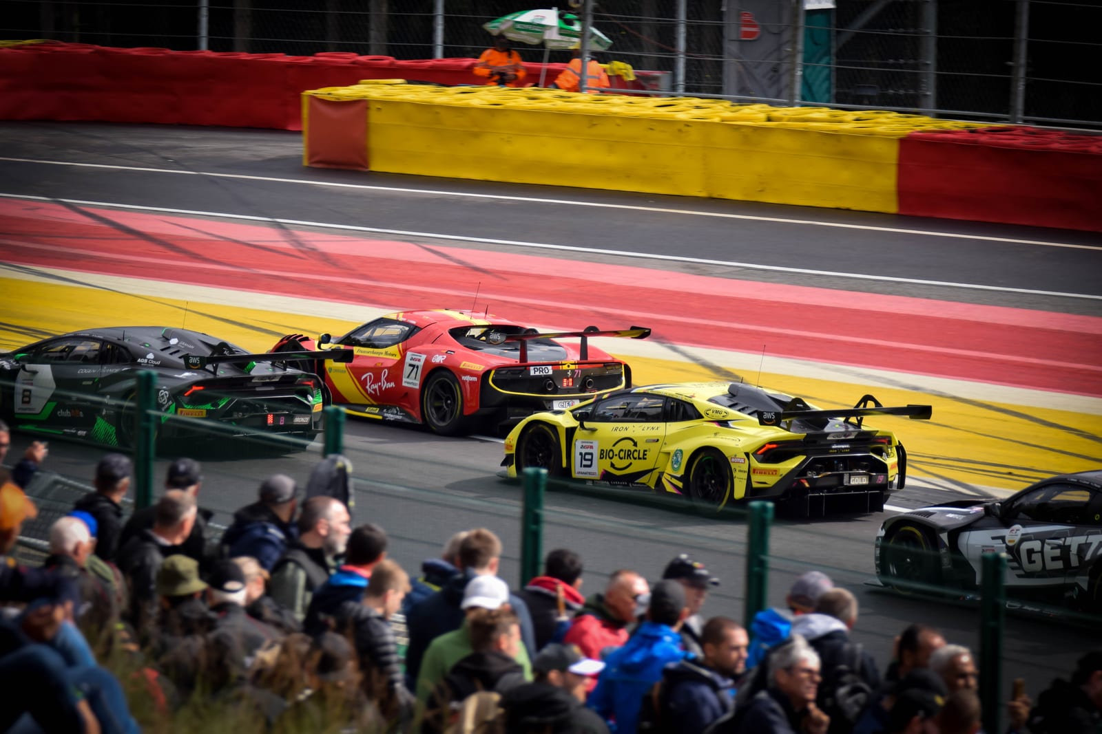 A pack of GT3 cars running nose-to-tail through Spa-Francorchamps