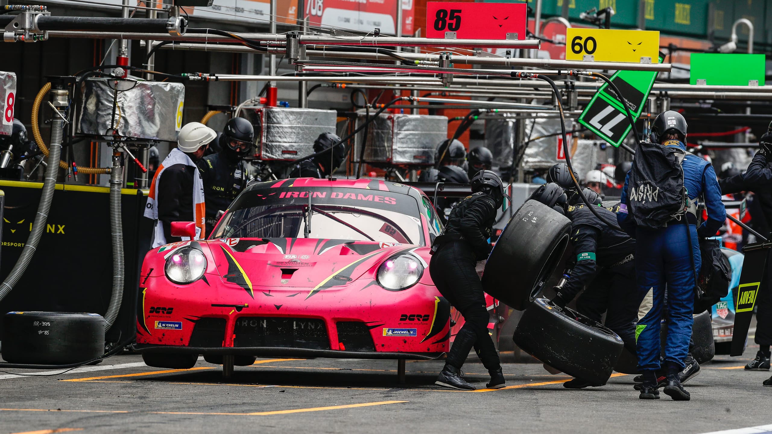 Porsche 911 GT3 R having tyres changed.