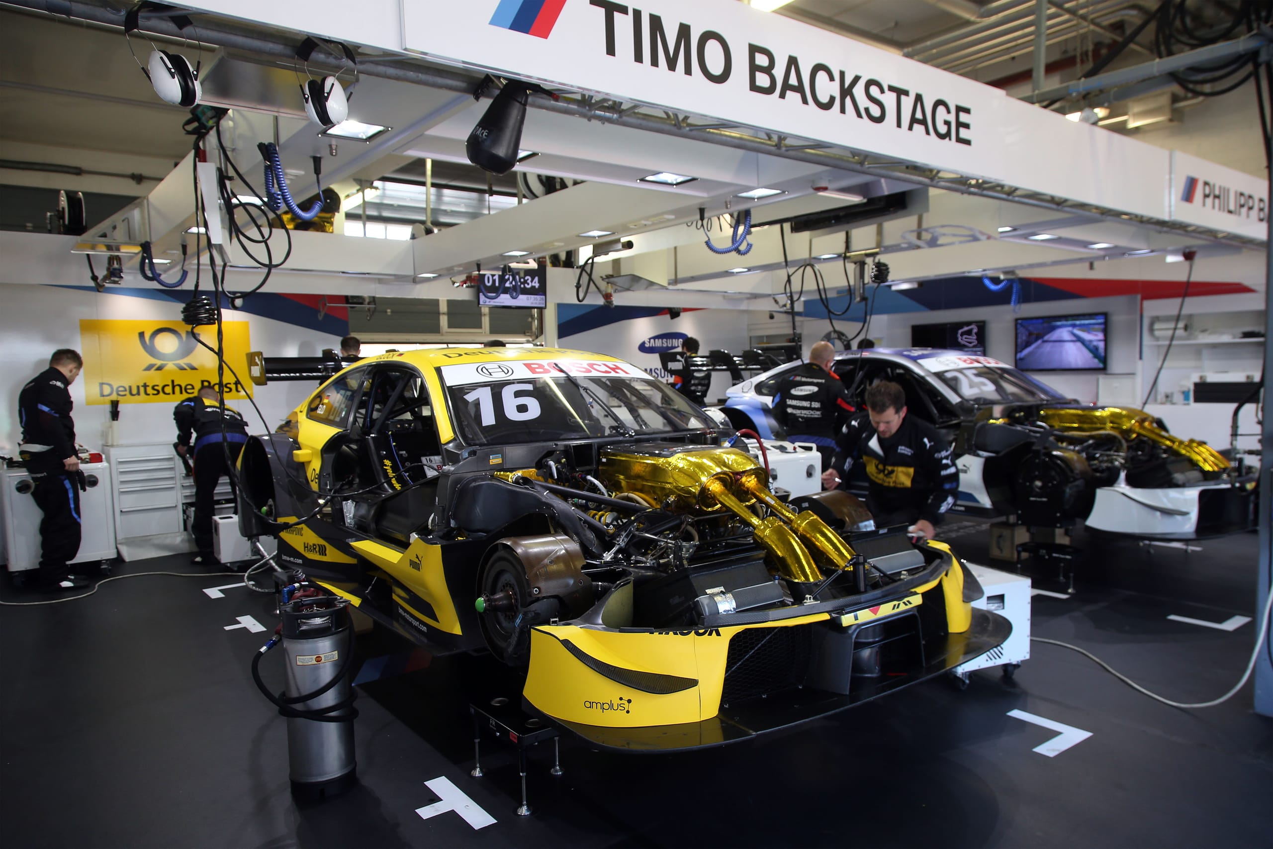 DTM racing car in action, representing a championship that benefits from rising rate suspension due to high aerodynamic loads