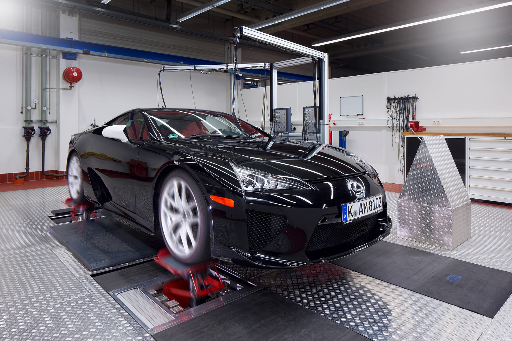 Lexus LFA on a four-post vehicle dynamics rig during suspension and handling setup