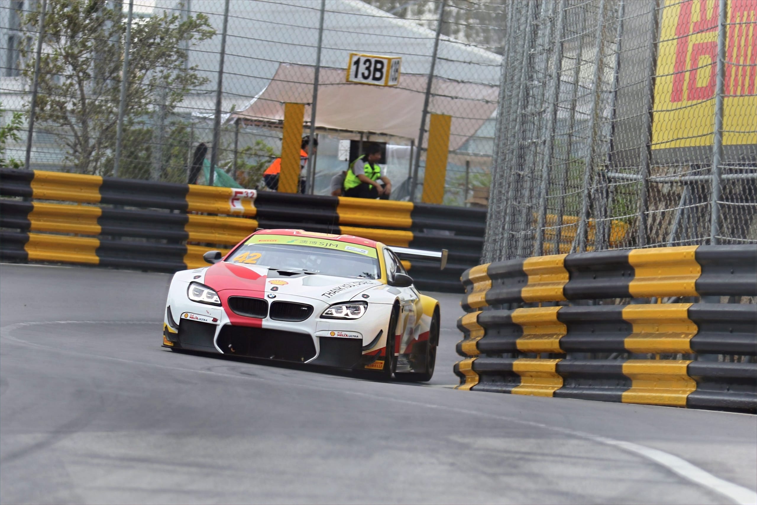 Racing car under lateral acceleration illustrating the relationship between cornering and weight transfer